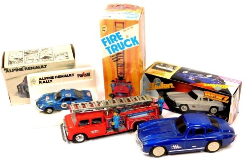 A Metal King tinplate friction fire engine with siren, a Mercedes Benz tinplate friction 300SL Gullwing, and a Polistil Alpine Renault diecast rally car. (3)