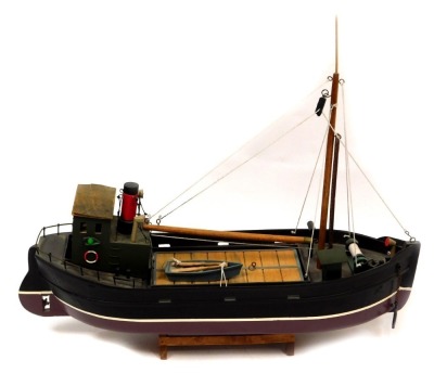 A scratch built tug boat, 44cm high, 50cm wide, 14cm deep.