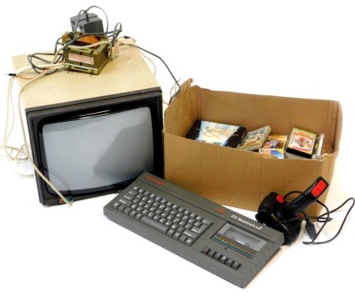 A Sinclair ZX Spectrum plus two, with a joystick and games, including Three Strikes, Brian Jack Super Star Challenge, etc., and a CRT monitor with transformer.