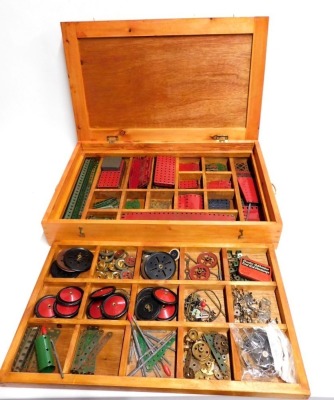 A pine and ply wood divider box containing Meccano, gears, wheels, nuts, bolts, etc. (1 box)