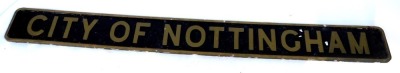 An arched railway engine sign The City of Nottingham, on wooden backing, painted on black ground with gold lettering, 194cm x 19cm.