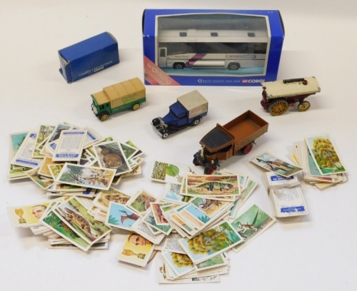 A National Express Corgi bus, Lesney Modern Amusement carriage, loose cigarette cards, etc. (1 tray)