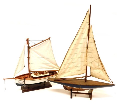 Two model pond yachts.