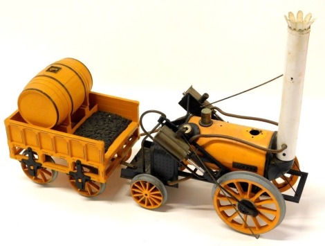 A Hornby O gauge live steam Stephenson's Rocket and tender.