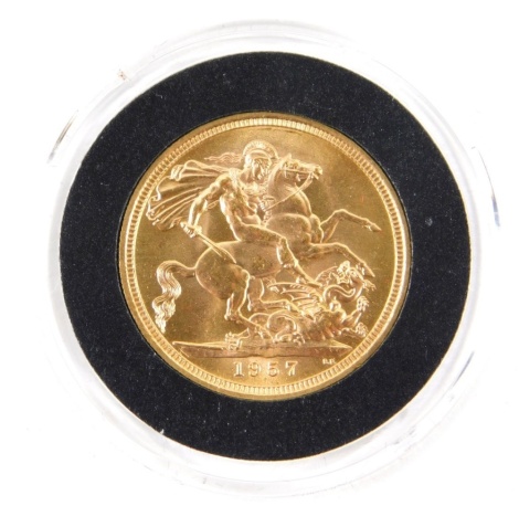 An Elizabeth II full gold sovereign, 1957, The First Gold Sovereign of Her Majesty's Reign, in plastic casing and outer Hatton's of London box, with paperwork.