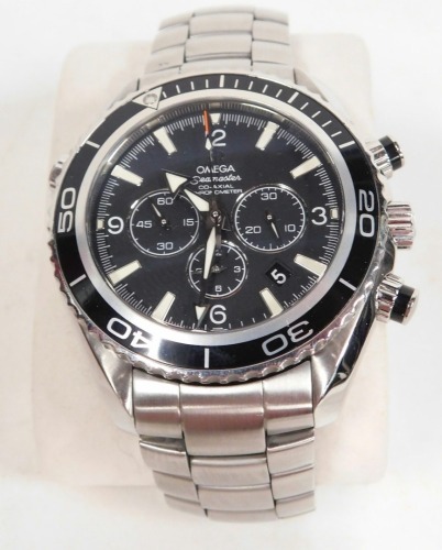 An Omega Seamaster Co-Axial Automatic chronometer chronograph, with stainless steel bracelet, articulated bezel, 3cm diameter black dial, with three further dials, baton and Arabic numerals, and arrow pointers, the strap marked Professional Planet Ocean w