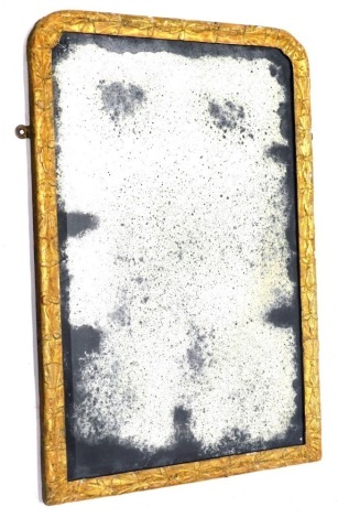 An 18thC gilt wall mirror, with rectangular discoloured plate, the frame decorated with flowers and leaves, etc., 77cm high, 51cm wide.