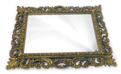 A Florentine style wall mirror, the rectangular plate surround by rococo scrolls, leaves, etc., 114cm high, 88cm wide.