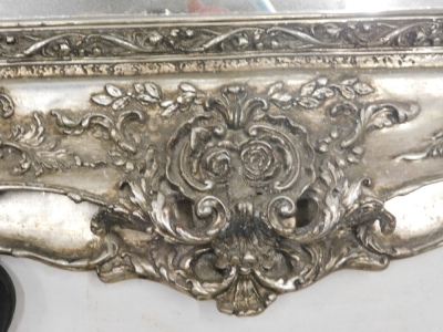 A large silvered rococo style wall mirror, rectangular bevelled plate, the frame decorated with scrolls, leaves, flowers, etc., 121cm high, 100cm wide. - 3