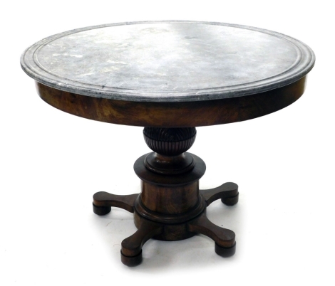 A Louis Philippe French Empire style library or centre table, the circular grey marble top with a moulded edge, on a plain frieze, the pedestal carved with leaves, etc., on a circular base with five shaped feet, 80cm high, 100cm diameter.