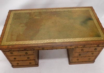 A Victorian pitch pine kneehole desk by A Blain and Son, Liverpool, carved to simulate bamboo, the rectangular top with a green leather inset, decorated in gilt with a Greek key border, supported by two pedestals, each with four graduated drawers with bra - 2