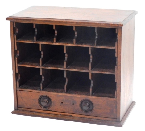 A set of 19thC mahogany pigeon holes, the top with a moulded edge above various divisions and a drawer, with turned wooden handles, 42cm high, 48cm wide, 27cm deep.