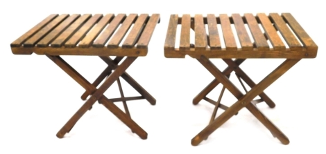 Two beech folding and adjustable luggage stands, 71cm wide.