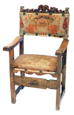 An 18thC continental walnut armchair, with woolwork back and seat.