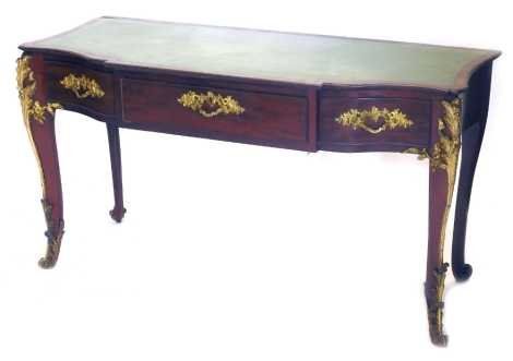 A 19thC French mahogany bureau plat, with green leather inset top, three frieze drawers with ormolu handles, and applied decoration to the front cabriole legs, 75cm high, 140cm wide, 59cm deep.