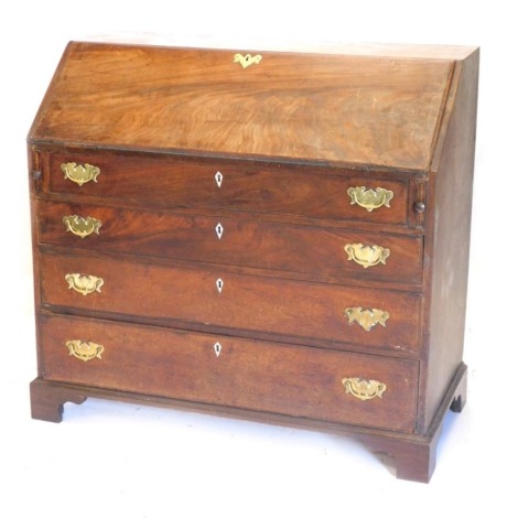 A George III flame mahogany bureau, with fall flap resting on lopers revealing a fitted interior, over four graduated drawers with replacement brass handles, and bracket feet, 110cm wide.