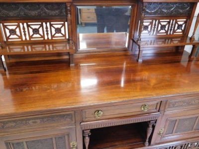 A 19thC aesthetic rosewood sideboard, in the manner of Lamb of Manchester, with central bevel glass surmounted by a raised metal work garland decoration, with carved floral patera above two shelves, single drawer and opening, flanked by further drawers an - 2