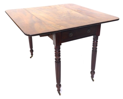 A William IV mahogany Pembroke table, with frieze drawer on reeded legs terminating in brass castors, 69cm high, 92cm wide, 53cm deep. - 3