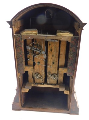 A 19thC walnut cased cuckoo clock, the 18cm diameter Roman numeric dial, in an arched case with a silvered floral inlay, scroll spandrels and bracket feet, with a eight day movement striking on the hour with pendulum and key, 45cm high - 3