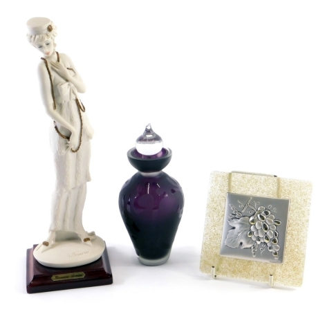 An amethyst and clear glass perfume bottle with stopper, an Armani figure, and a Cortellani plaque on glass back, 10cm x 9cm.