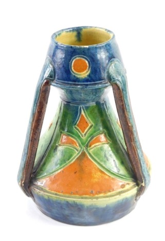 A Linthorpe style Art Nouveau pottery tyg, numbered 146, vibrantly decorated in orange, green, and blue, 21cm high.