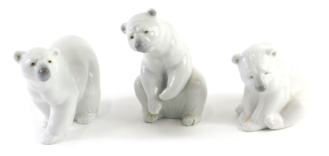 Three Lladro polar bears, two seated, one walking, the largest 15cm high.