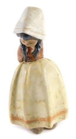 A Lladro porcelain figure of a Dutch girl, with mottled glazes, 18cm high.