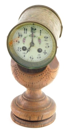 A French clock movement and dial, the dial painted with flowers and leaves, with cylindrical casing, on a heavily carved wooden stand. (AF)