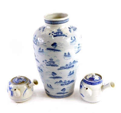 A modern Oriental blue and white vase, decorated with landscapes, etc., two Japanese sake pots.