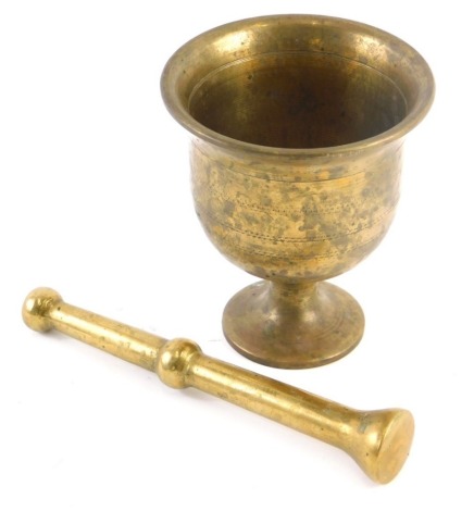 A turned brass pestle and mortar, possibly 19thC, the mortar 11cm high.