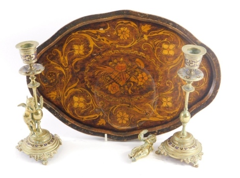 A pair of French brass and champleve enamel candlesticks, in the manner of Barbedienne, each decorated with Putti, etc., 20cm high (AF), and a poker work tray. (3)