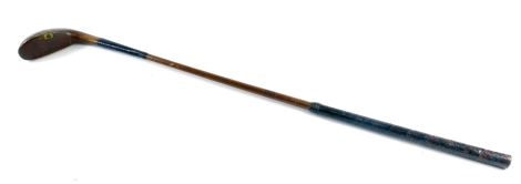 An Addington Special Apicary shafted golf putter, 82cm long. (AF)