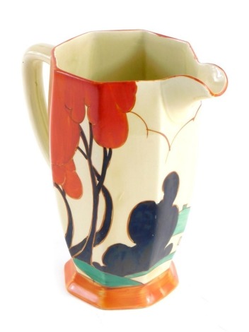 An Art Deco jug, decorated with red trees, a cottage with green roof, etc., bearing stamp to underside Clarice Cliff Bizarre Fantasque, 20cm high.