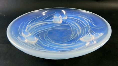 A French Etling opalescent glass shallow bowl, decorated with flowers, signed to underside, 23cm diameter.