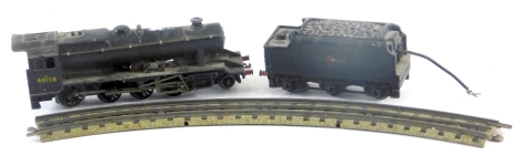 A diecast locomotive, in black livery, with tender, etc.