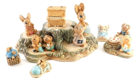 A Pendelfin three tier stand, a smaller stand, and various Pendelfin figures.