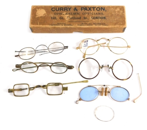 Various optical items and spectacles, a Curry & Paxton box containing various rolled gold and other spectacles with curved side bars, other metal framed spectacles, etc. (a quantity)