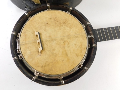 An early 20thC ebonised banjo, in canvas case. (AF) - 2