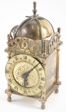 A 20thC Smiths Clocks and Watches brass miniature lantern clock, with bell top, 8cm diameter Roman numeric chapter ring, stencilled centre, on baluster feet, 21cm high.