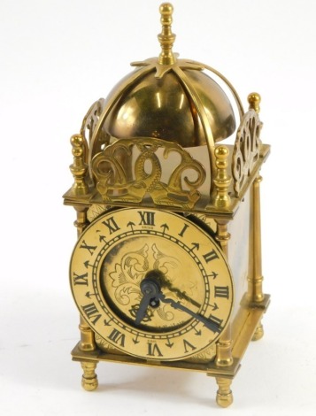 A 20thC Smiths Clocks and Watches brass miniature lantern clock, with bell top, 8cm diameter Roman numeric chapter ring, stencilled centre, on baluster feet, 21cm high, boxed.