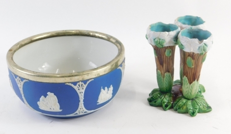 A 19thC Majolica triple stem vase, with bark work and leaf sections, in turquoise brown and green, 14cm high, and a Wedgwood dark blue Jasperware, bowl, with plated mounts. (2, AF)