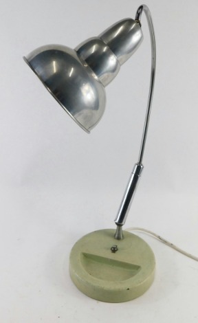 A vintage chrome and metal table lamp, with cone shade, articulated arched stem and circular foot with recess, with electrical feature and on/off switch, 58cm high. (AF)  WARNING! This lot contains untested or unsafe electrical items.  It is supplied for