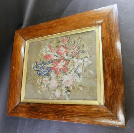 A 19thC rosewood frame, with a needlework of a still life, 38cm x 26cm, the frame 51cm x 44cm.