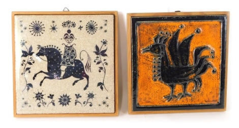 A Porsgrund Norwegian pottery griffin tile, in orange and black, on wooden backing, marked verso, 20cm x 18cm, and a further tile. (2)