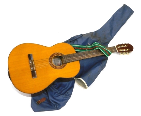 A Peerless Classic model 3052 Japanese acoustic guitar, in outer case.