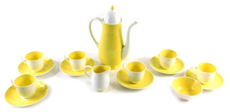 A mid 20thC Susie Cooper part coffee service, in yellow dot and white decoration, comprising coffee pot, 24cm high, sugar bowl, milk jug, six cups and saucers, printed marks beneath. (a quantity, AF)