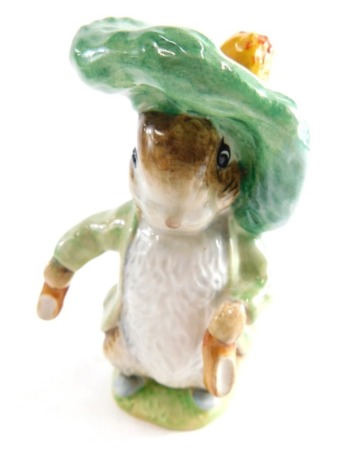 A Beswick pottery Beatrix Potter figure Benjamin Bunny, gold oval mark beneath, 10cm high.