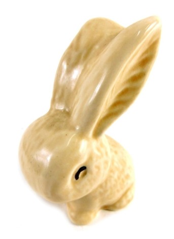 A 20thC miniature Sylvac rabbit, in brown, marked England beneath, 9cm high.