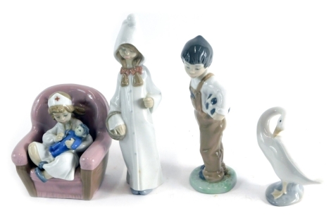 Various Lladro and Nao figures, boy holding football 18cm high, girl nurse, Lladro figure of a girl in flowing robes and a goose, various marks beneath. (4)