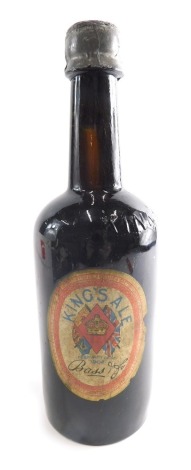 An early 20thC Coronation King's Ale Bass Ale Commemorative bottle, with fixed lid, unopened, marked King's Ale Bass, 26cm high.